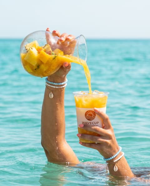 Arm Pours from a Pitcher by the Ocean